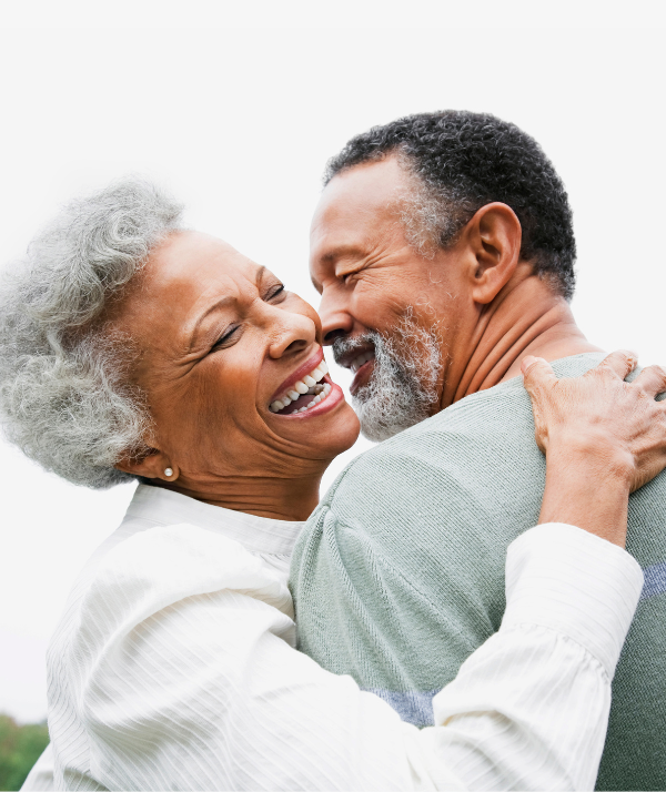 Senior couple hugging and smiling