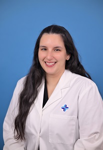 Rennette Zavala headshot in white lab coat